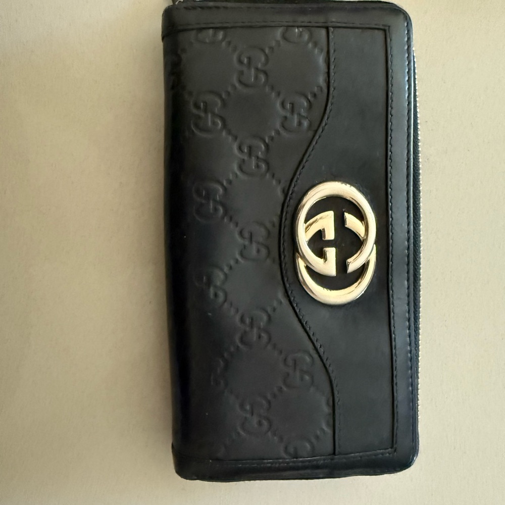 Gucci Black Embossed Wallet with Gold Emblem